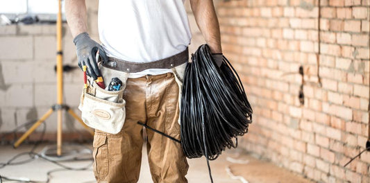 electrician-with-tools-working-construction-site-repair-handyman-concept